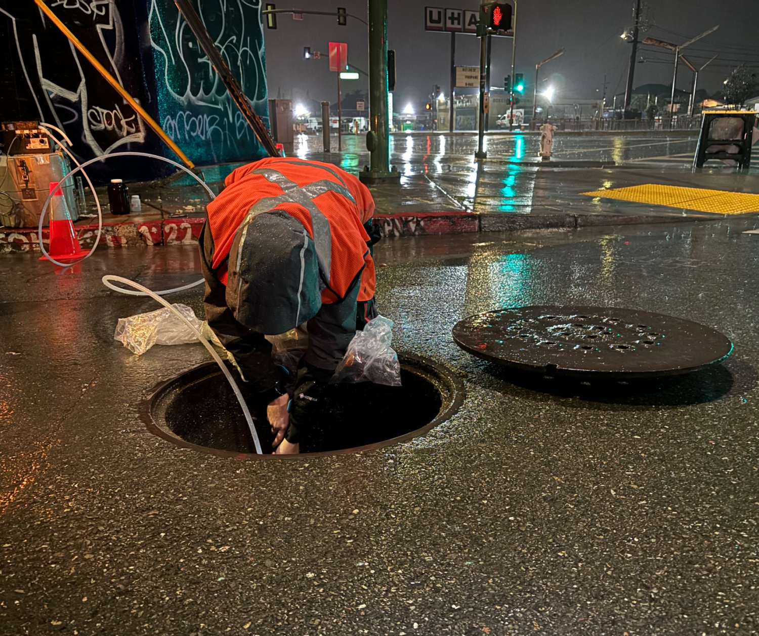 Man peering in manhole