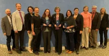 People standing with awards