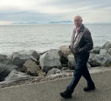 Warner Chabot walking at the Bay's edge