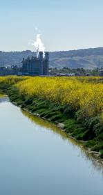 Channel of water with industry in the background