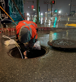 Man peering in manhole