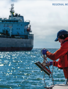 2025 RMP Update cover showing scientist in red jacket holding sampler bailer and rope over side of boat on a sunny day
